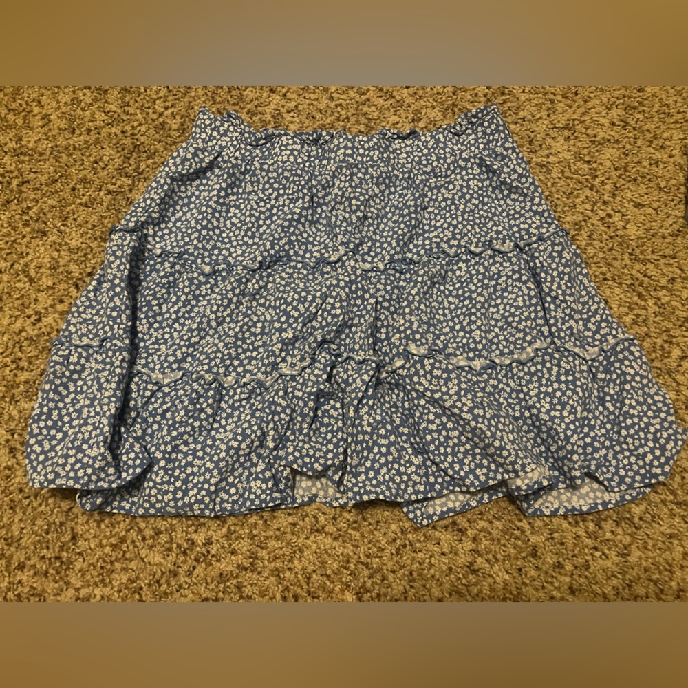 Blue short skirt with white floral print. Size medium from Wild Fable.